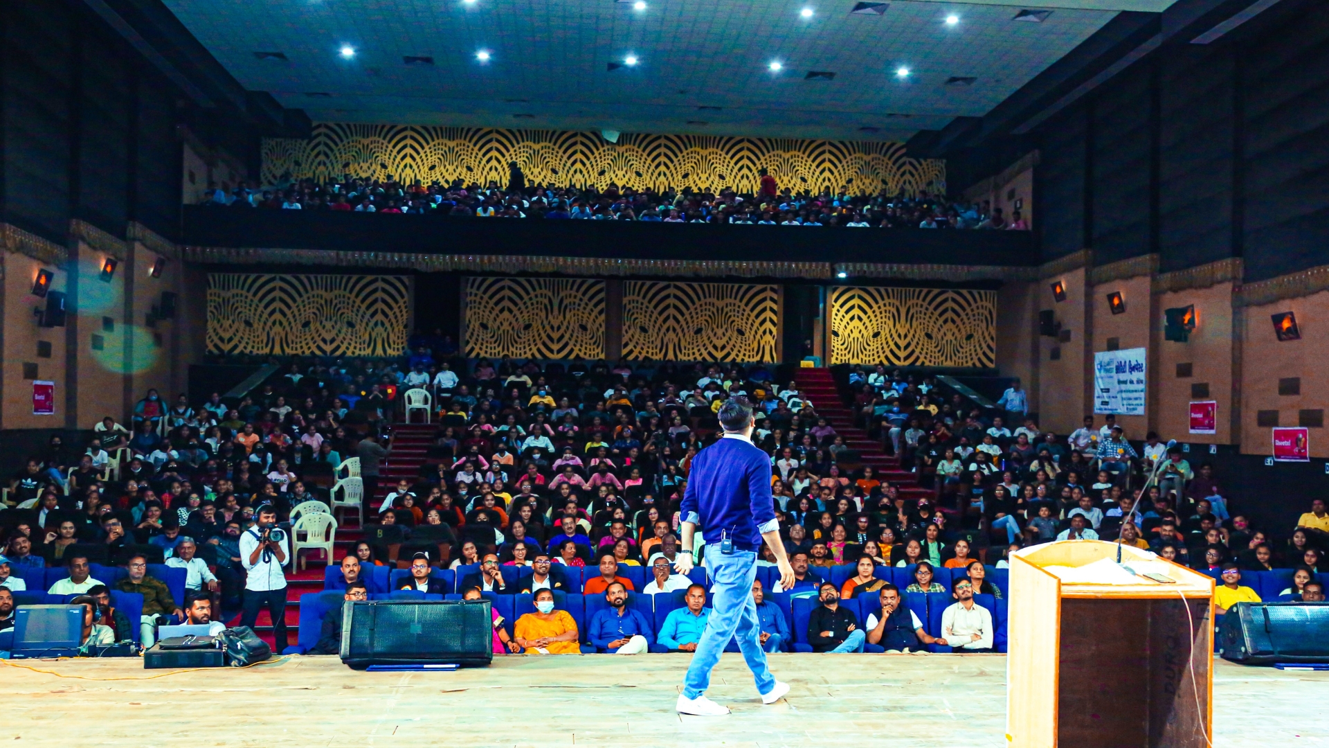 Paras Pandhi addressing a full auditorium