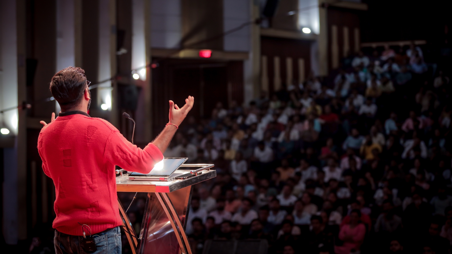 Paras Pandhi speaking to participants on stage